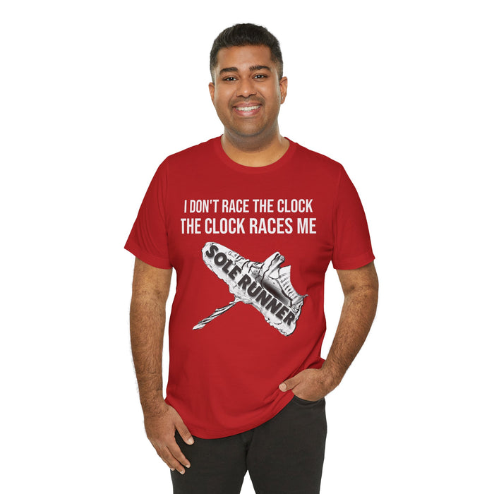 I Don't Race The Clock. The Clock Races Me: Unisex Jersey Short Sleeve Tee