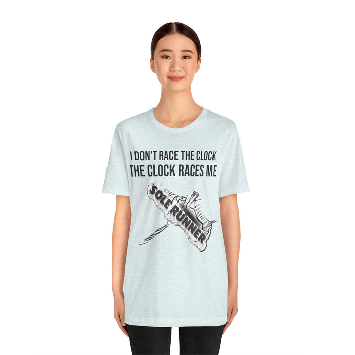 I Don't Race The Clock. The Clock Races Me: Unisex Jersey Short Sleeve Tee