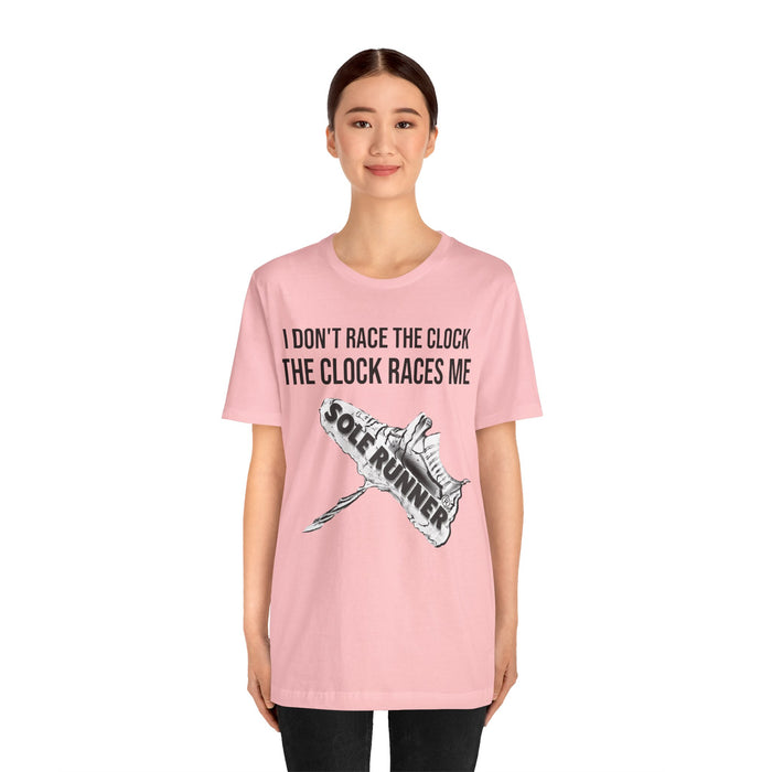 I Don't Race The Clock. The Clock Races Me: Unisex Jersey Short Sleeve Tee