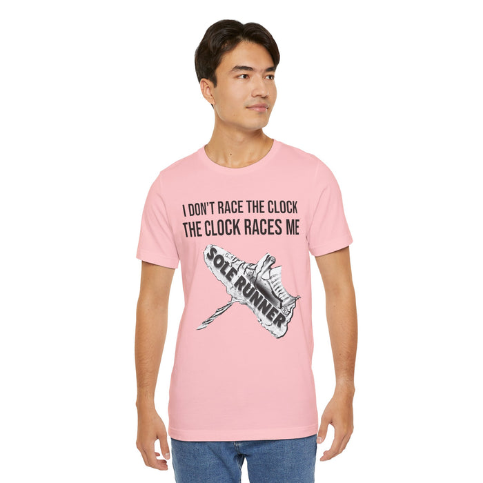 I Don't Race The Clock. The Clock Races Me: Unisex Jersey Short Sleeve Tee