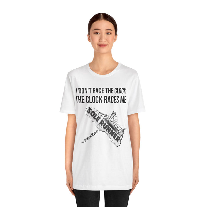 I Don't Race The Clock. The Clock Races Me: Unisex Jersey Short Sleeve Tee