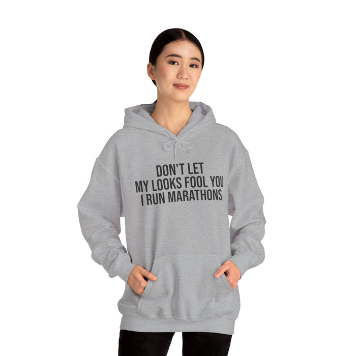 Don't Let My Looks Fool You. I Run Marathons: Unisex Heavy Blend™ Hooded Sweatshirt