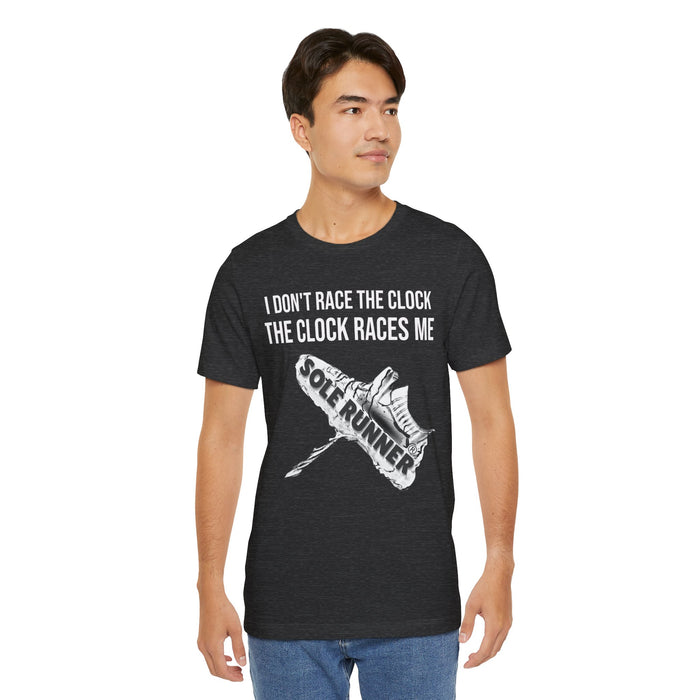 I Don't Race The Clock. The Clock Races Me: Unisex Jersey Short Sleeve Tee