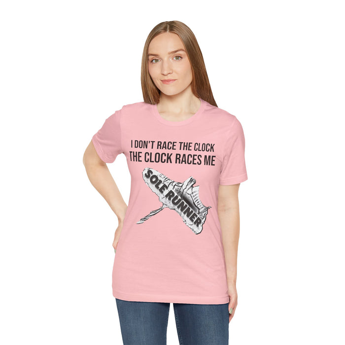 I Don't Race The Clock. The Clock Races Me: Unisex Jersey Short Sleeve Tee