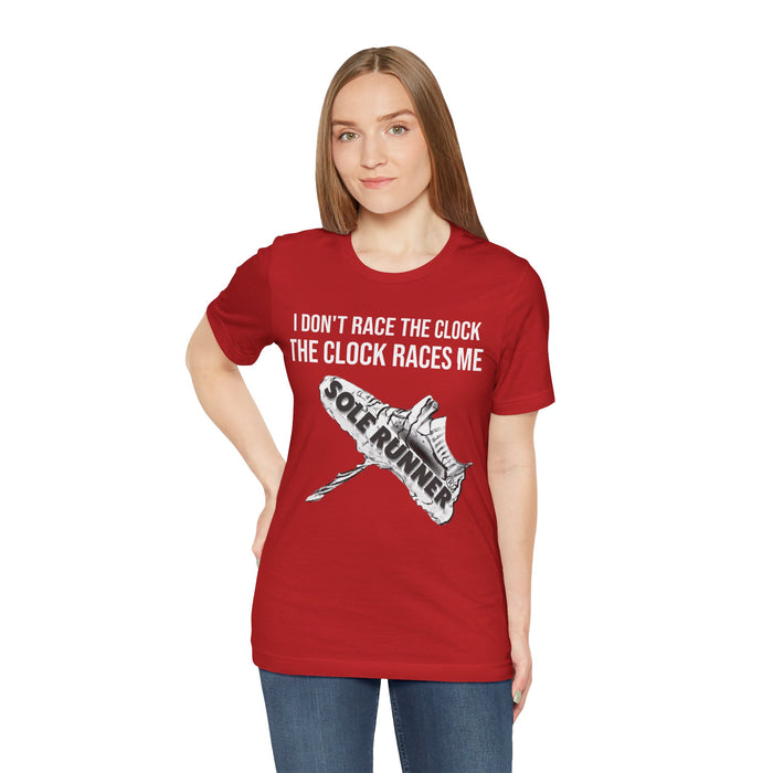 I Don't Race The Clock. The Clock Races Me: Unisex Jersey Short Sleeve Tee