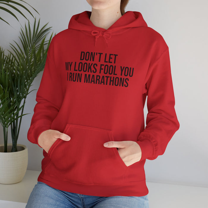 Don't Let My Looks Fool You. I Run Marathons: Unisex Heavy Blend™ Hooded Sweatshirt