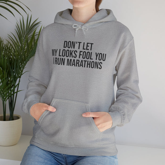 Don't Let My Looks Fool You. I Run Marathons: Unisex Heavy Blend™ Hooded Sweatshirt
