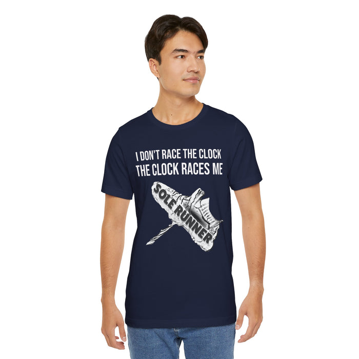 I Don't Race The Clock. The Clock Races Me: Unisex Jersey Short Sleeve Tee