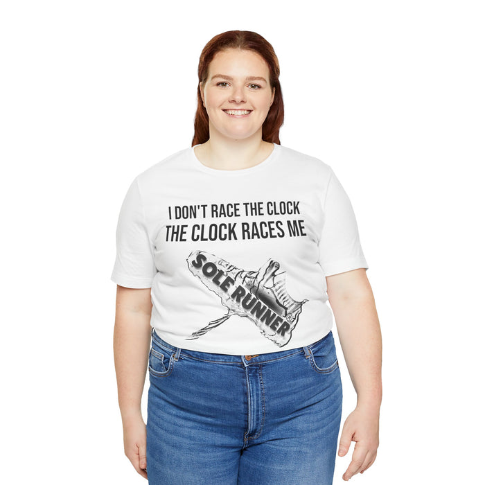 I Don't Race The Clock. The Clock Races Me: Unisex Jersey Short Sleeve Tee