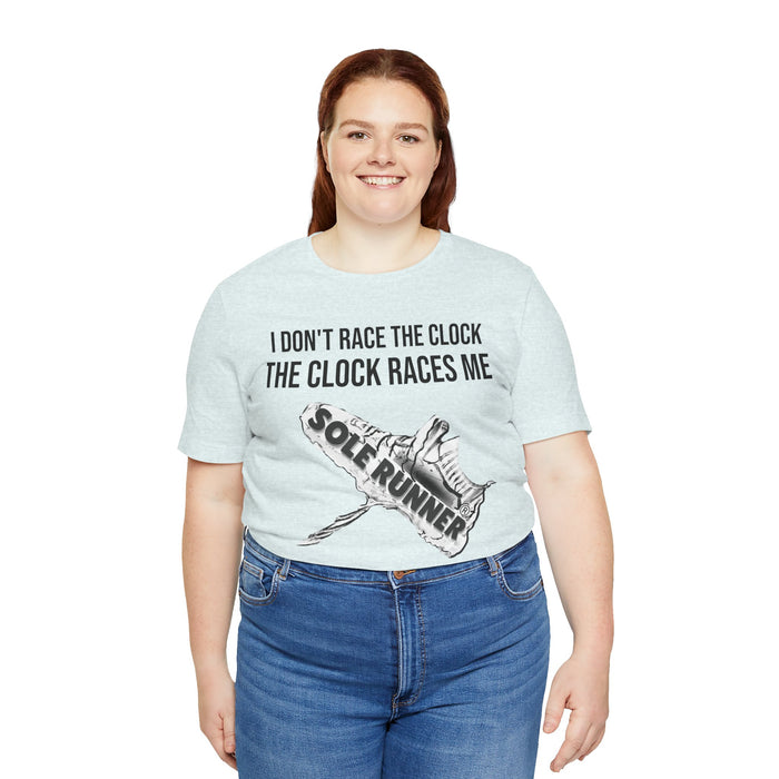 I Don't Race The Clock. The Clock Races Me: Unisex Jersey Short Sleeve Tee