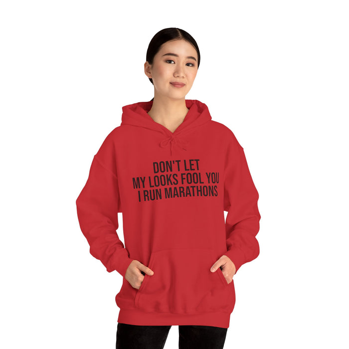 Don't Let My Looks Fool You. I Run Marathons: Unisex Heavy Blend™ Hooded Sweatshirt