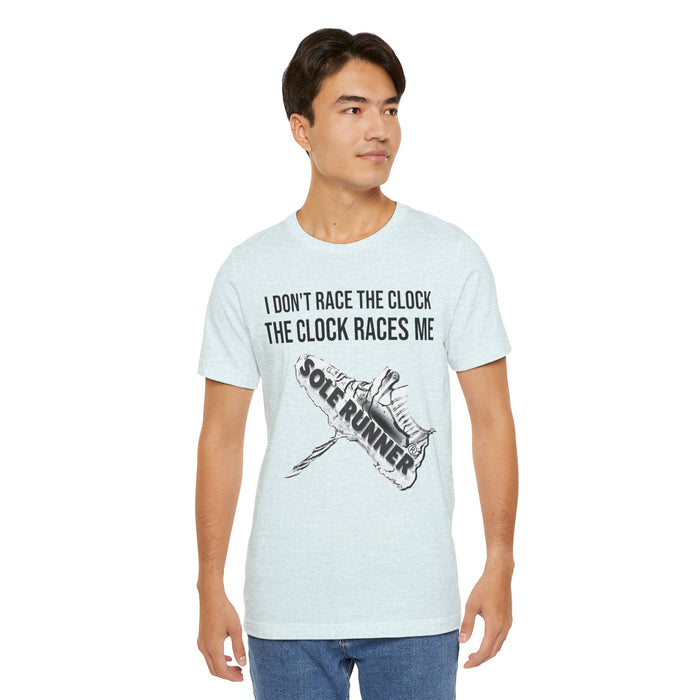 I Don't Race The Clock. The Clock Races Me: Unisex Jersey Short Sleeve Tee